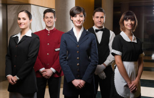 B62PW9 Hotel staff standing together and smiling